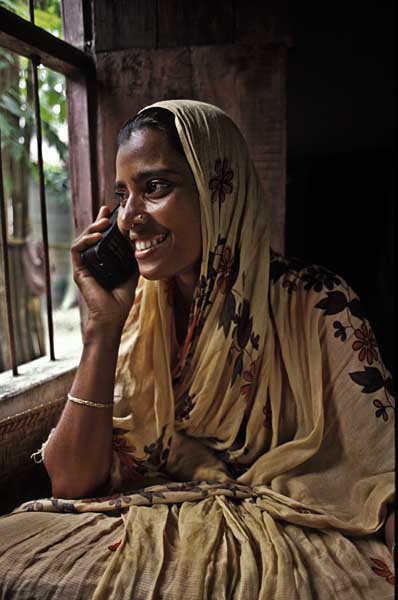 Salma, a housewife in Norshingdi, receives a call from her husband, a migrant labourer in Singapore. Rural women in Bangladesh have set up small mobile phone businesses which now allow easier communication in villages.